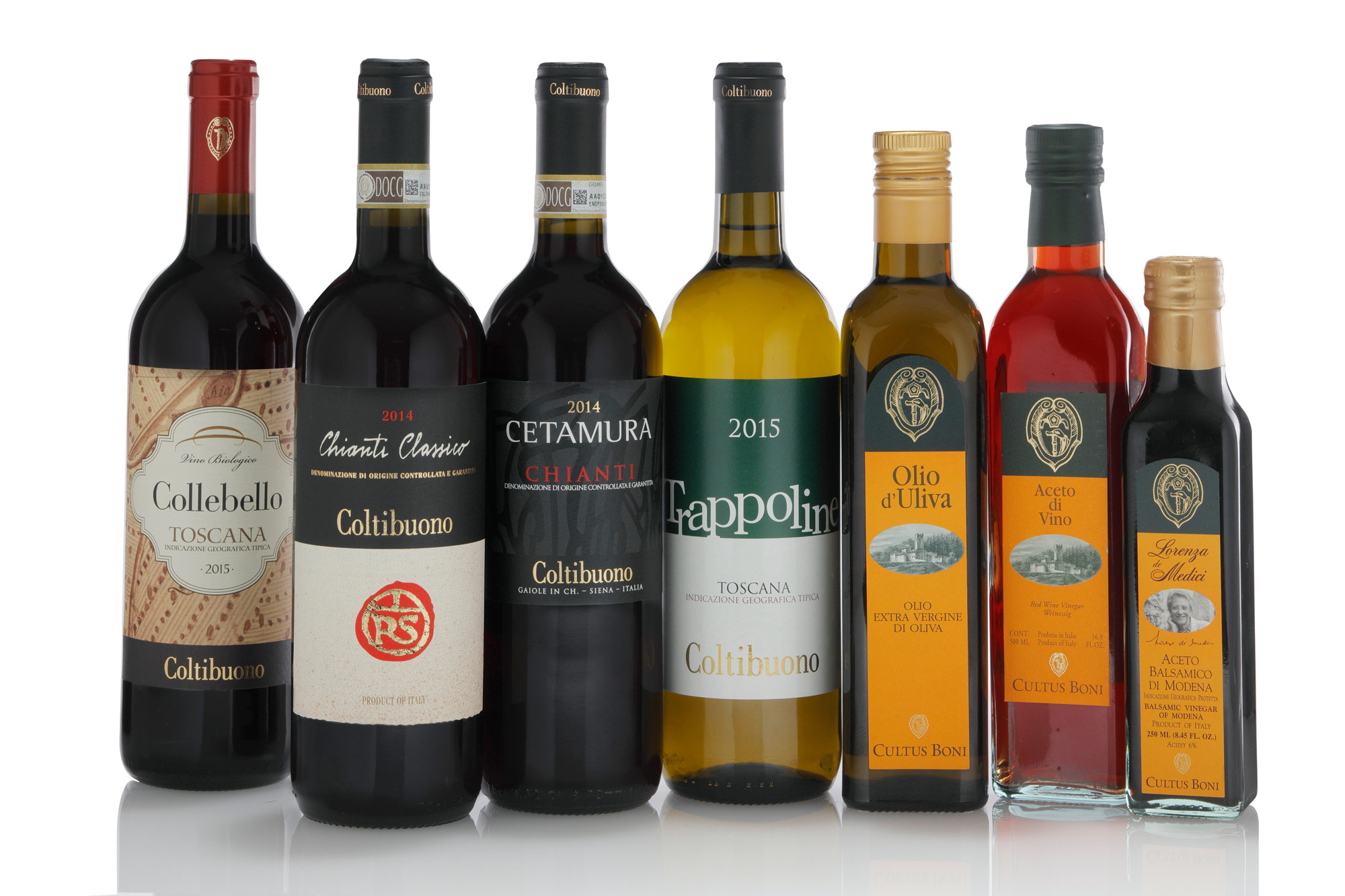 immagine fotografica di una serie di bottiglie di Vino ,olio e aceto di Badia a Coltibuono su sfondo bianco